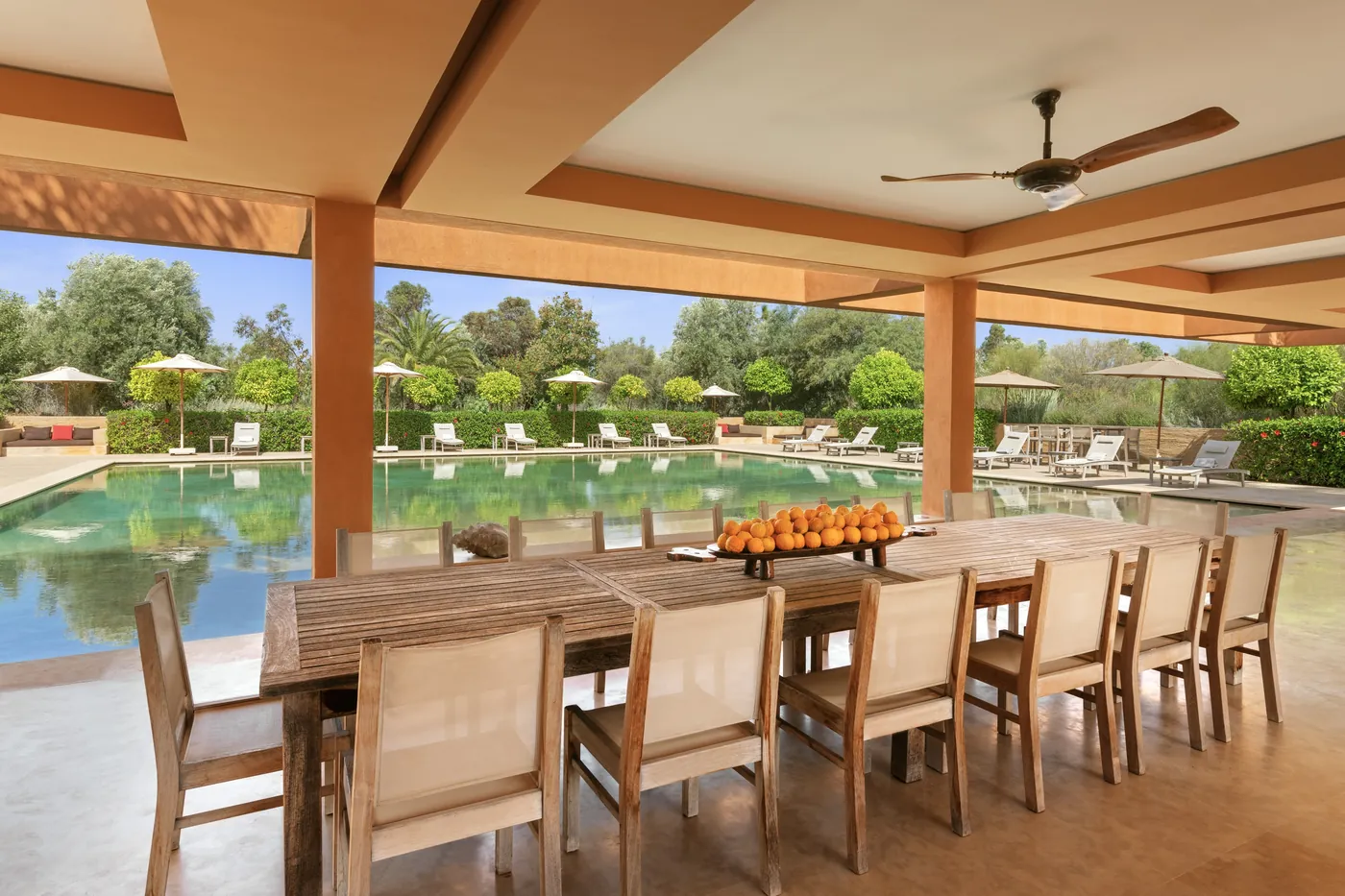 Shaded dining terrace beside the swimming pool