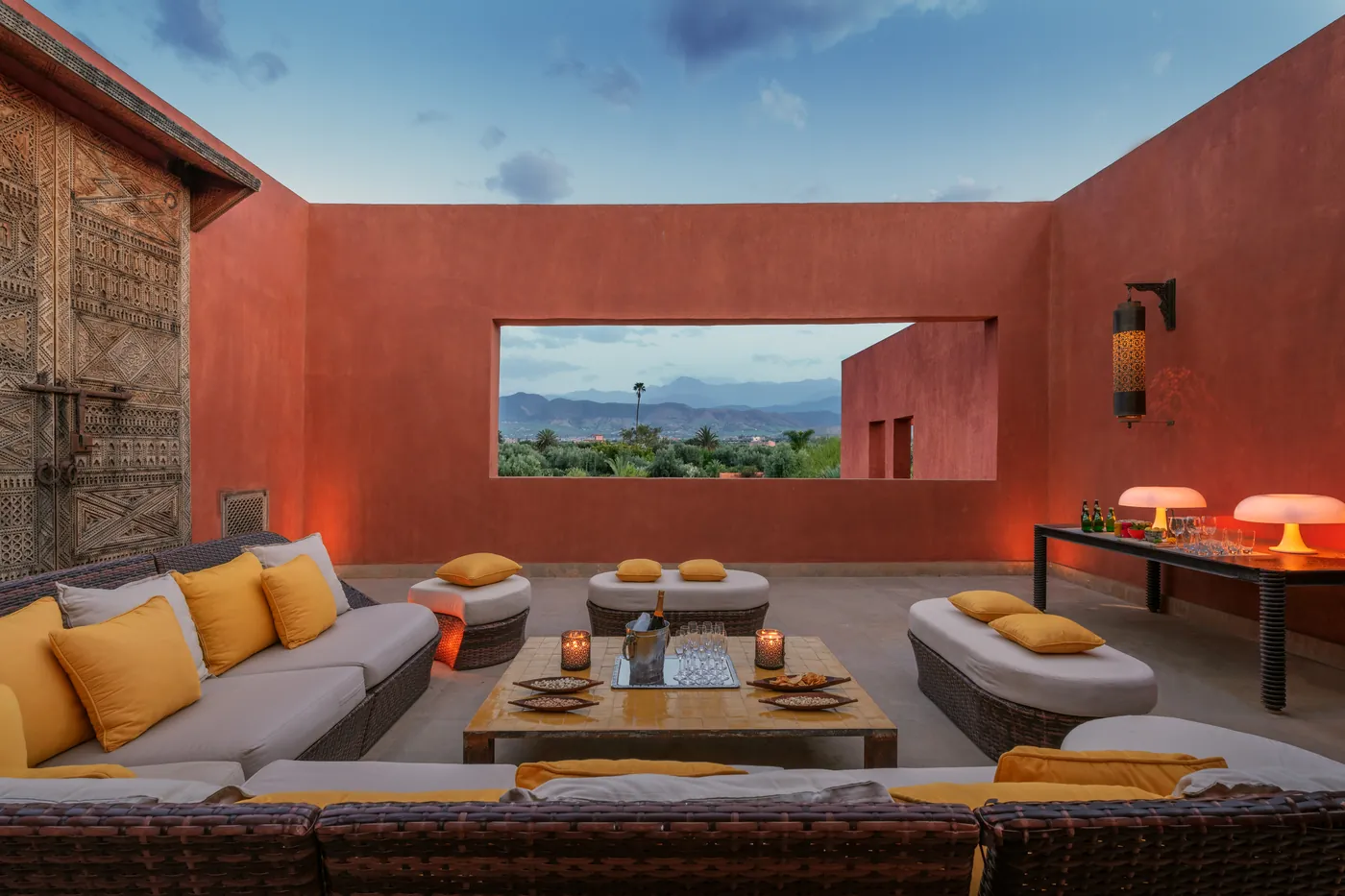 Colourful Moroccan outdoor lounge with mountain views