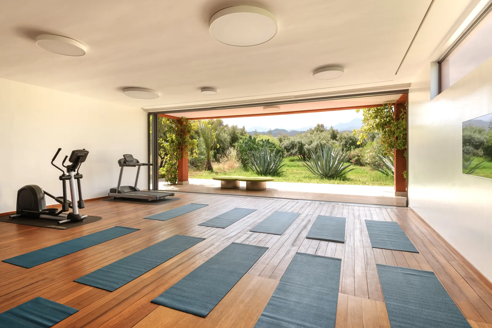 Light-filled yoga studio opening onto the gardens