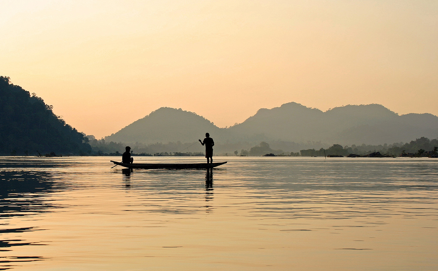 A boat on the Mekong at sunset in Cambodia
