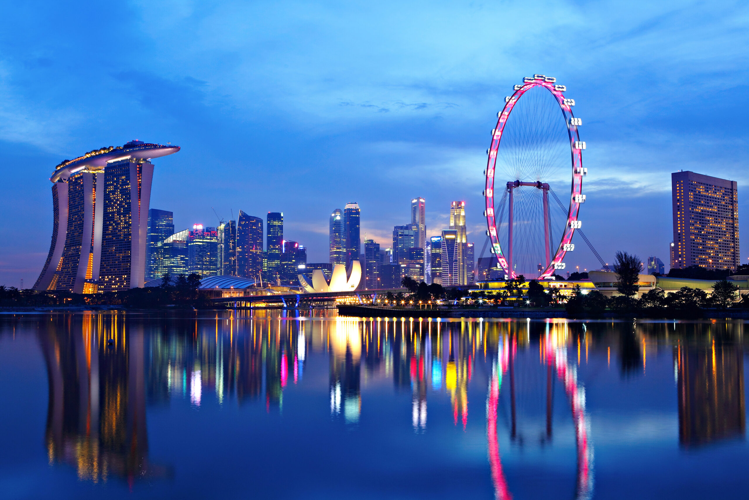 Singapore skyline and Singapore Flyer reflected in Marina Bay