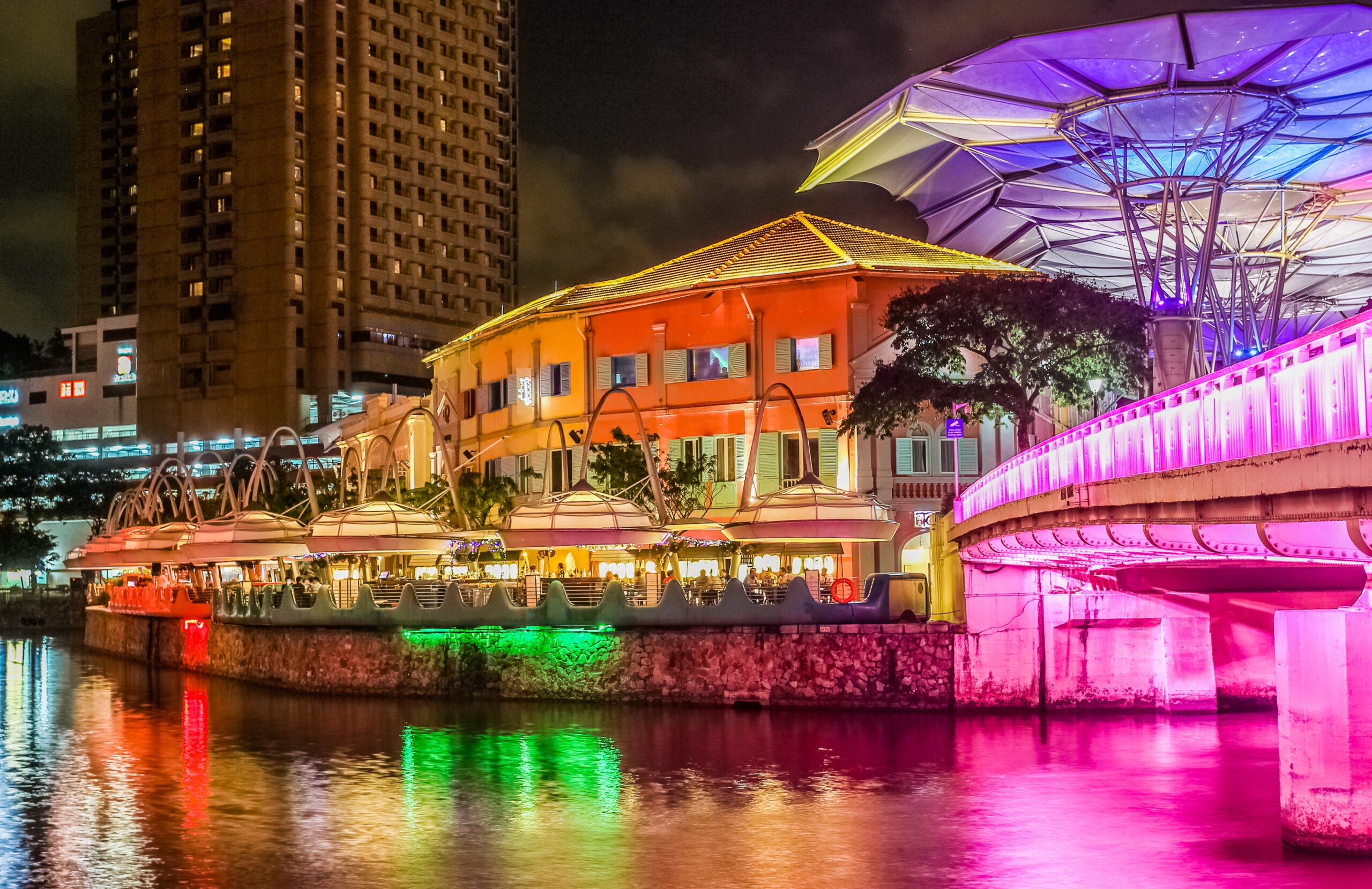 Singapore riverside illuminated in the evening